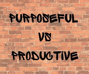 Brick wall with the words Purposeful vs. Productive