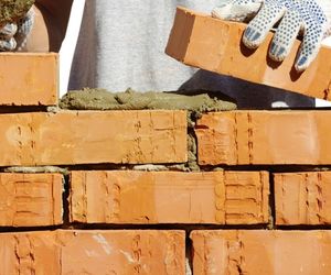 Bricklayer laying bricks 